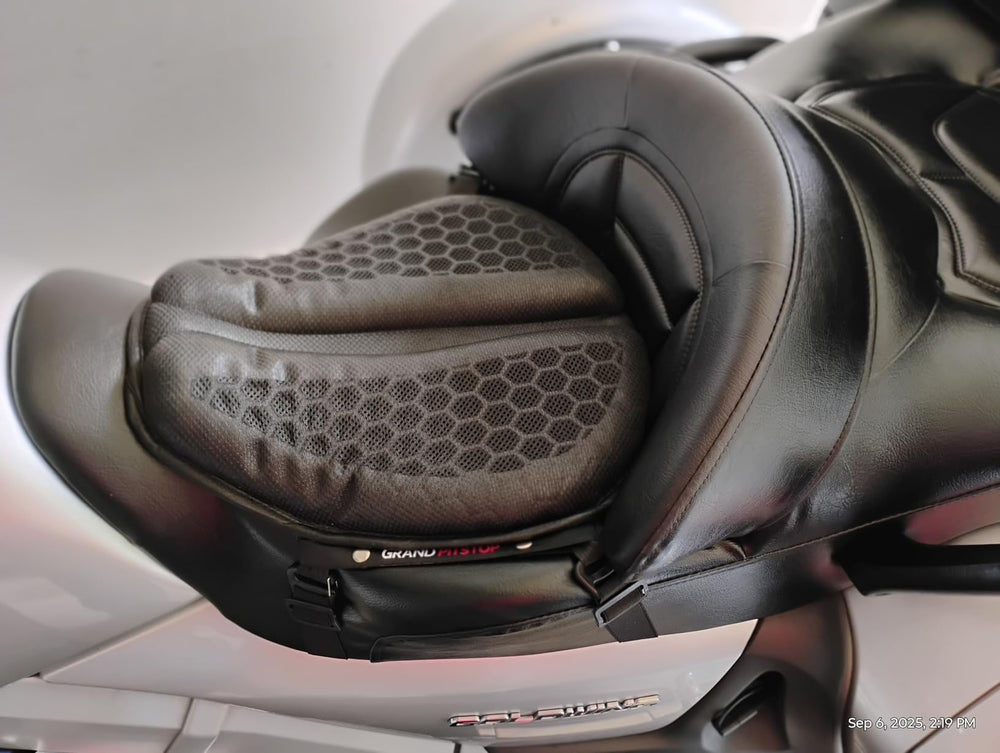 Contoured black gel cushion positioned on the rider section of a motorcycle seat